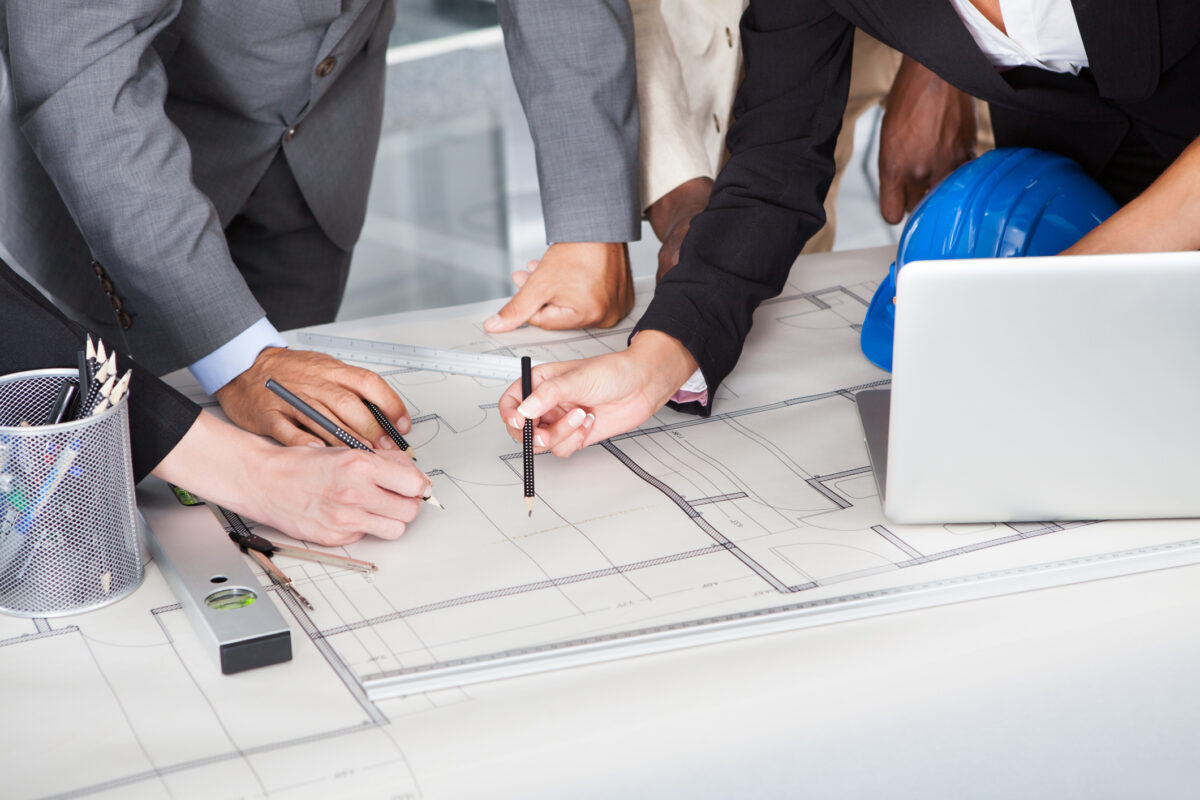 Group Of Businesspeople Discussing Together